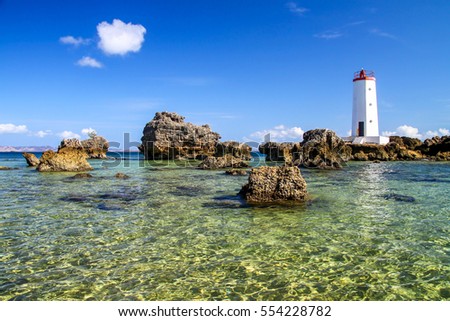 Lighthouse on the northern tip of Madagascar in Antisiranana ( Diego Suarez ) Royalty-Free Stock Photo #554228782