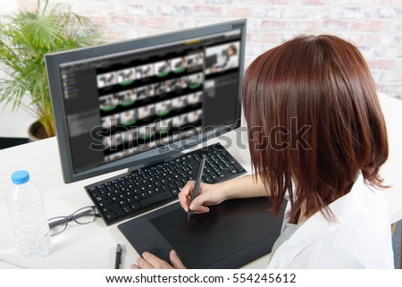 young  woman designer using computer for the video editing