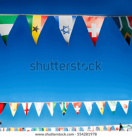 blur in south africa      decorative  waving flags from all over the world and sky