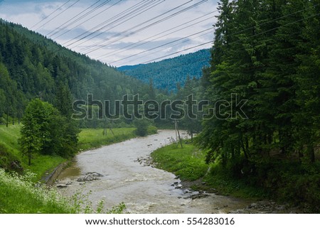 River of mountain with misty fog and rain cloud sky.                               