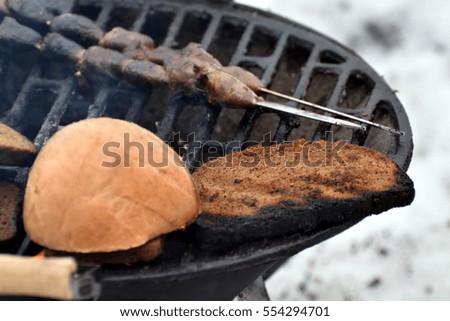 meat and bread on fire