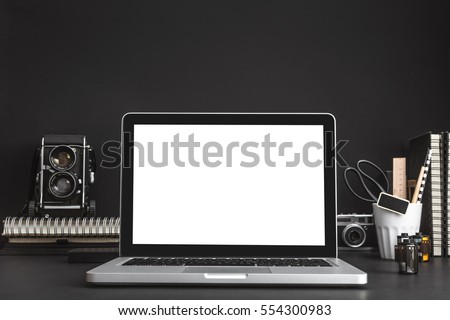 Mock up laptop and medium format camera on artist, designer or photographer table.  