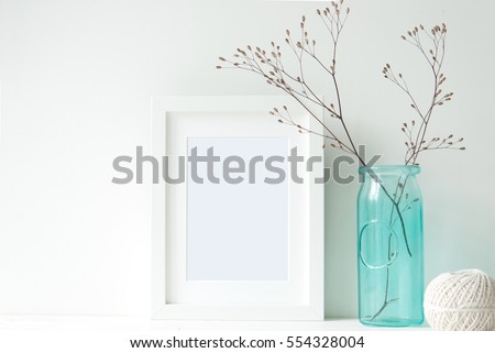 Minimal white frame with turquoise vase