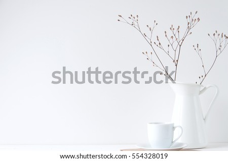 Minimal elegant composition with coffee cup and white vase