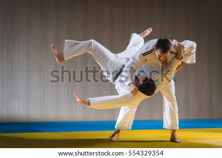 Judo sport training in the sports hall Royalty-Free Stock Photo #554329354