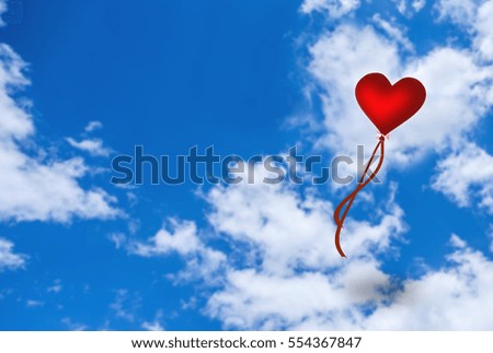 red heart shape balloon blowing over blurred cloudy sky,Image for happy valentine day concept.