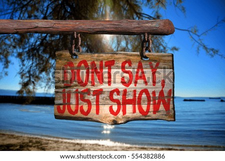 Dont say, just show motivational phrase sign on old wood with blurred background