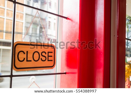 Vintage looking closed sign in the shop, stock photo