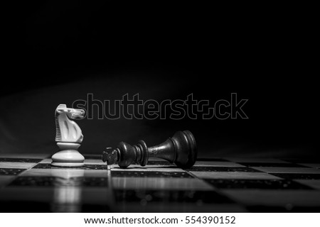Chess photographed on a chessboard Royalty-Free Stock Photo #554390152