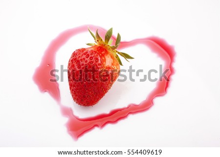 closeup studio photo of one strawberrie inside shinny heart from strawberry syrup  isolated on white background