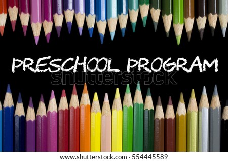 Education Concept : Preschool Program on blackboard with colorful pencils as a frame.