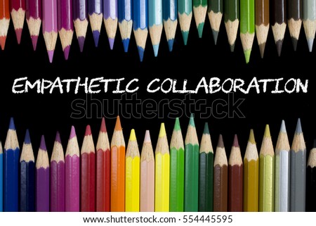 Education Concept : Empathetic Collaboration on blackboard with colorful pencils as a frame.