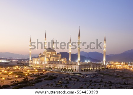 Sheikh Zayed Grand Mosque in Fujairah illuminated at night. United Arab Emirates, Middle East Royalty-Free Stock Photo #554450398