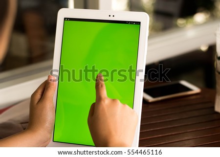 Closeup  tablet with green screen.