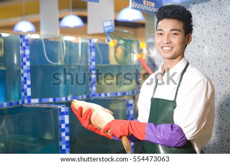 	A supermarket seafood salesman	