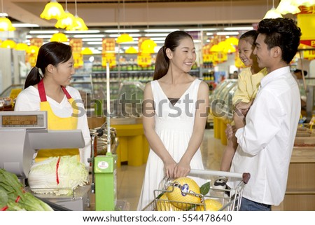	The supermarket clerk and customer	