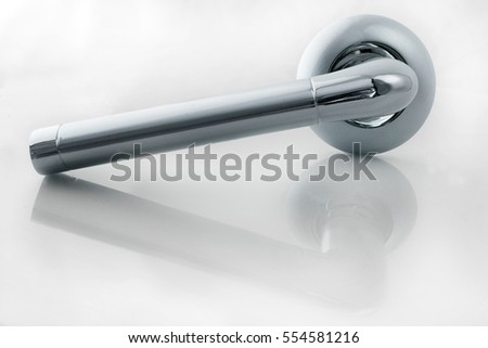 Silver door handle isolated on a white background