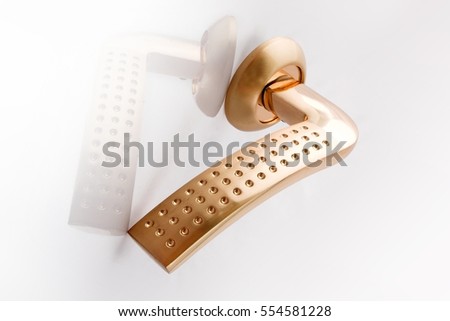 Golden door handle isolated on a white background