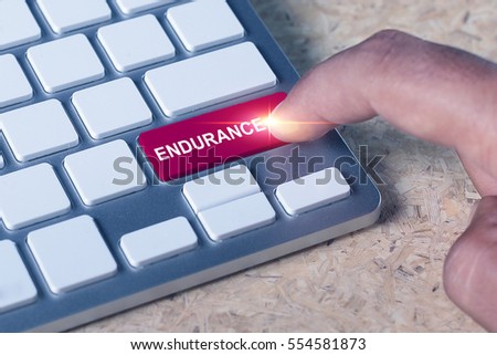 Man pressed keyboard button with endurance word