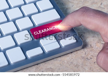 Man pressed keyboard button with clearance word