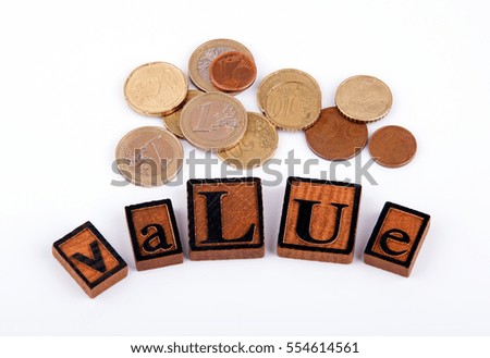 Value. Wooden letters on a white background