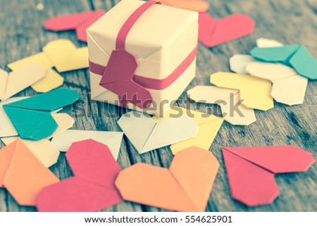 Gift box and paper heart for giving to loved ones on Valentine's Day.(Vintage color tone image)