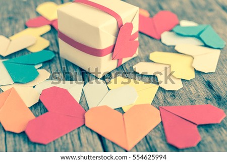 Gift box and paper heart for giving to loved ones on Valentine's Day.(Vintage color tone image)