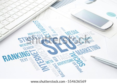 Seo business, search engine optimization, concept cloud chart. Print document, keyboard, pen and smartphone. Blue toned.