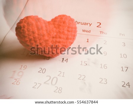 Double exposure of red heart and white calendar background for valentine's day concept.