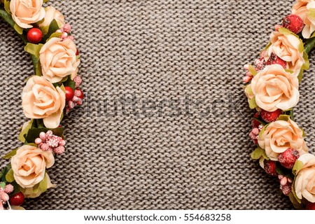 a wreath of flowers on textile background