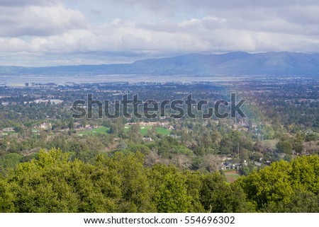 View towards south San Francisco bay after a storm; landscape with rainbow, California