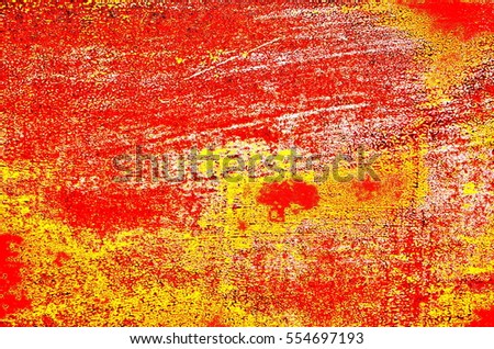 Textured scratched background in red and yellow colors. Abstract digitally manipulated image.