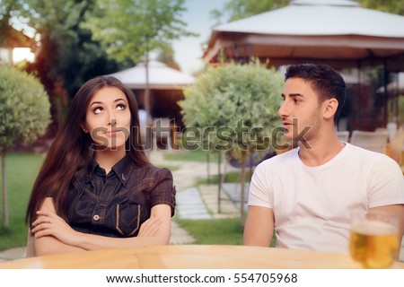 Couple Arguing on a Date at a Restaurant - Annoyed girlfriend listening to her boyfriend reproaches 