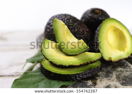 Green ripe avocado from organic avocado plantation - healthy food Royalty-Free Stock Photo #554762287