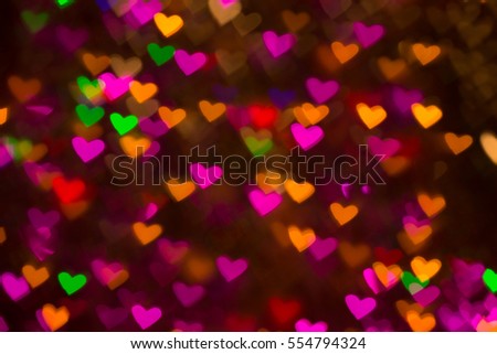 Hearts background. Abstract picture on Valentine's Day and love. Shine, bokeh, glow.