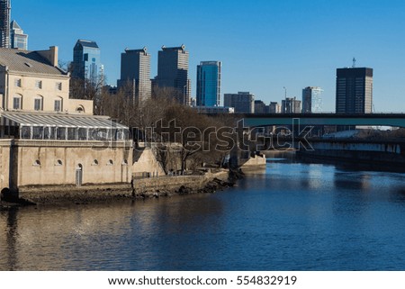City scene with Philadelphia skyline and a beautiful river front.  Pennsylvania. 