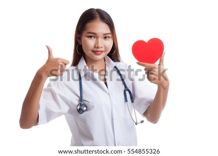 Young Asian female doctor show thumbs up with red heart  isolated on white background.