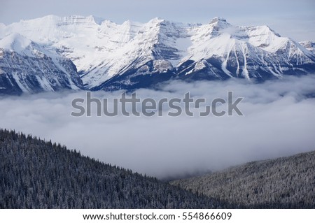 Picture of temperature inversion at Lake Louise, causing a cloud of sea in the area.