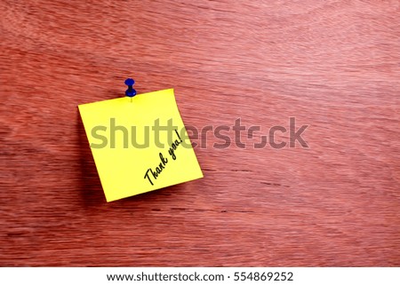 sticky note pin on wooden board with text Thank you! lower