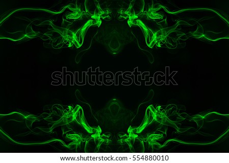 Abstract green smoke black space as background Royalty-Free Stock Photo #554880010