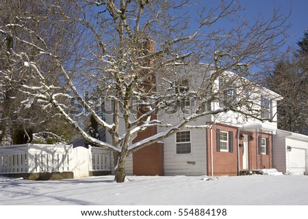 Family home for sale and snow covered ground Gresham Oregon.