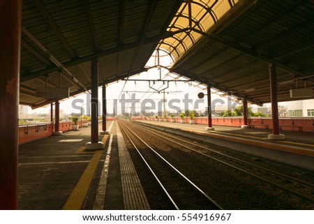 Empty station with many platforms and a sun light  photo taken in Jakarta Indonesia