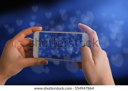 Woman using his cell phone photography bokeh.