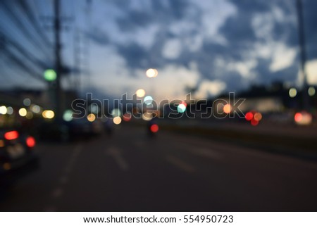 Blurred lights night view, city office building and road