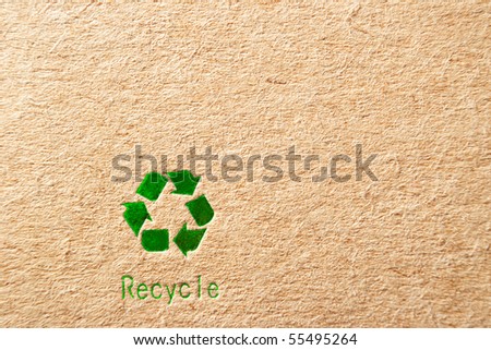 cardboard box background with green recycle symbol