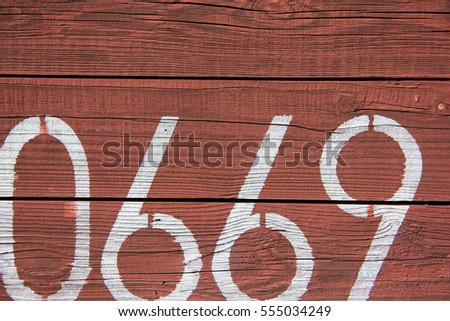 Numbers on wooden exterior of train wagon. Artistic background. Soft Focus. Poster template, social media post template.
