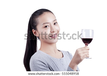 	young woman holds a glass of red wine	