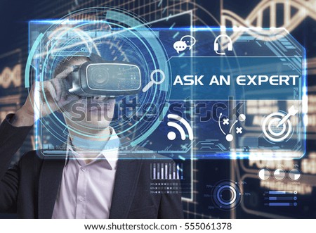 Business, Technology, Internet and network concept. Young businessman working in virtual reality glasses sees the inscription: ask an expert