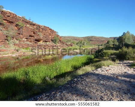 An outback desert waterhole in the Finke River bed at Palm Valley in the Northern Territory. Royalty-Free Stock Photo #555061582
