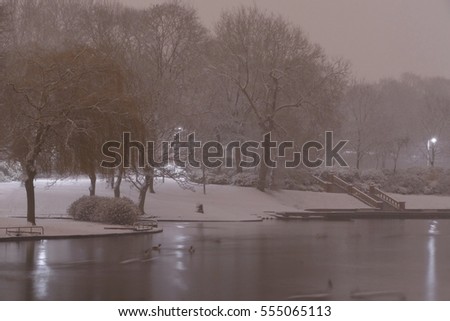 Stoke-on-Trent, Staffordshire, Midlands, England, UK, Europe. 12 January 2017. Unusual snowy evening in Stoke. Hanley park covered in snow. Picture of a lake with cold atmosphere. All white and pretty